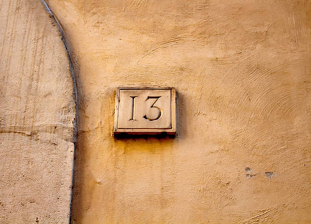 istock View of a building number (13) in Rome. 627229602