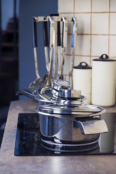 istock Stainless steel cooking pot on a stove and kitchenware 627230112