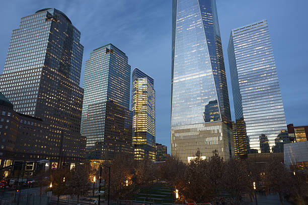 istock Area around 9/11 memorial with adjacent skyscrapers at twilight 627230148