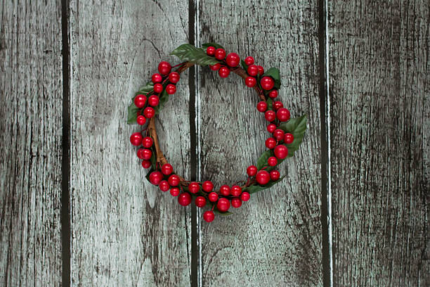 istock Christmas wreath decorated with red berries 627232356