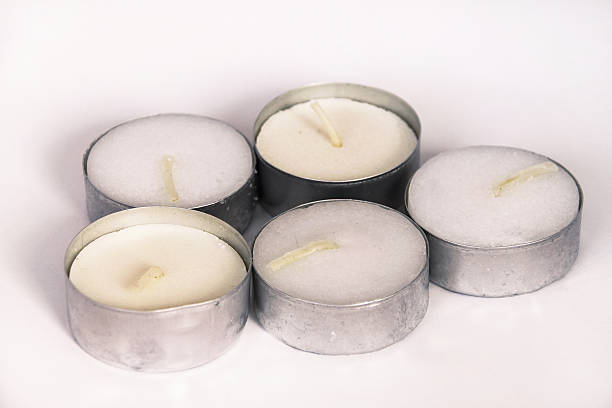 маленькие белые свечи - tea light candle white single object стоковые фото и изображения
