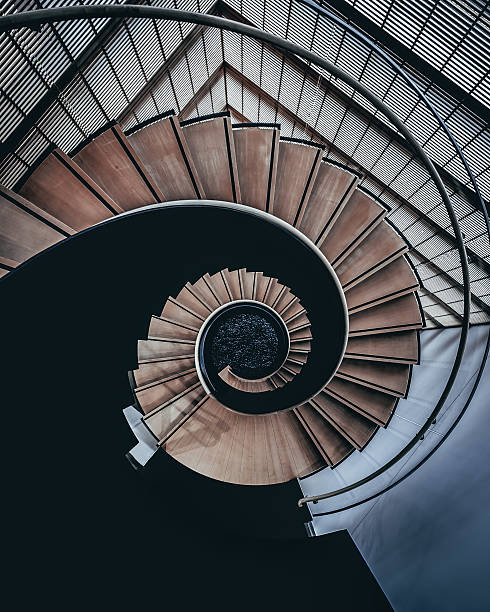 istock Upside view of a spiral staircase 627232712