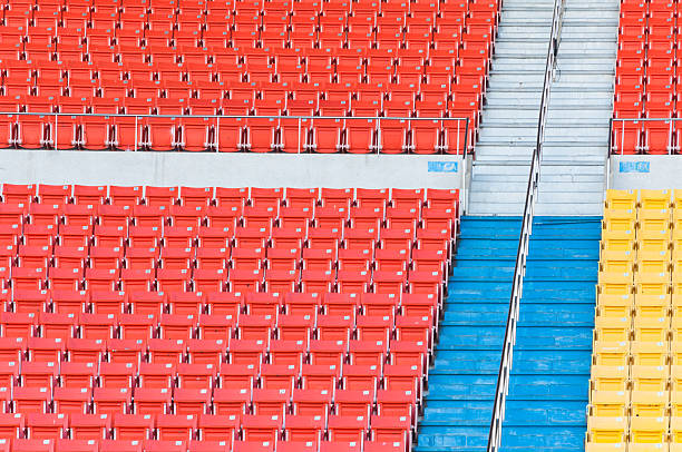 istock Empty orange and yellow seats at stadium 627232876