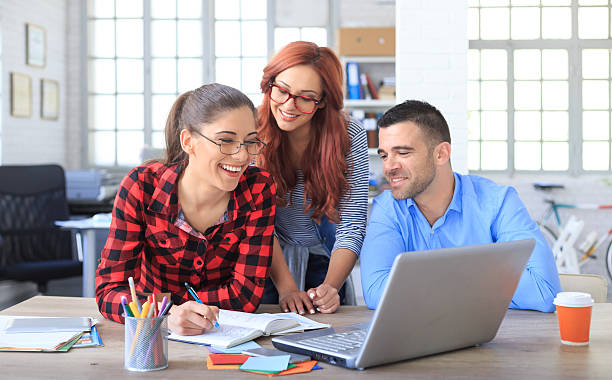 istock Young people working together in modern office 627240596