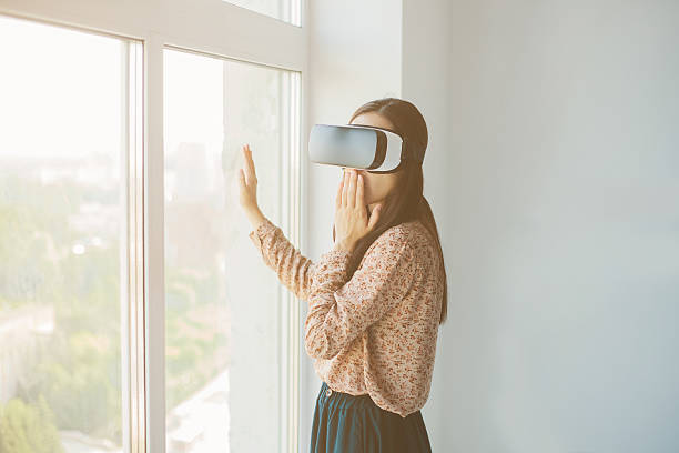 istock Woman with glasses of virtual reality. Future technology concept. 627247028