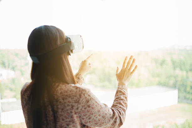 istock Woman with glasses of virtual reality. Future technology concept. 627247138