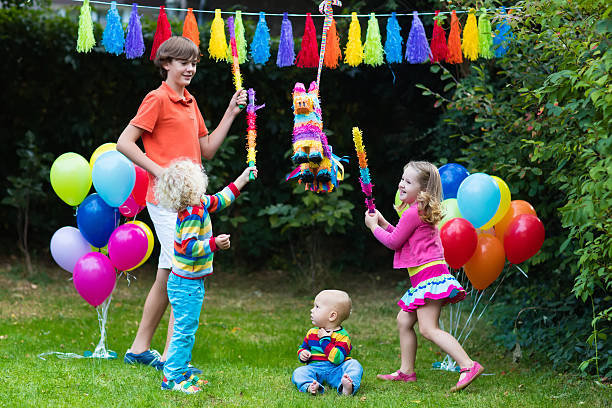 istock Kids playing with birthday pinata 627247720