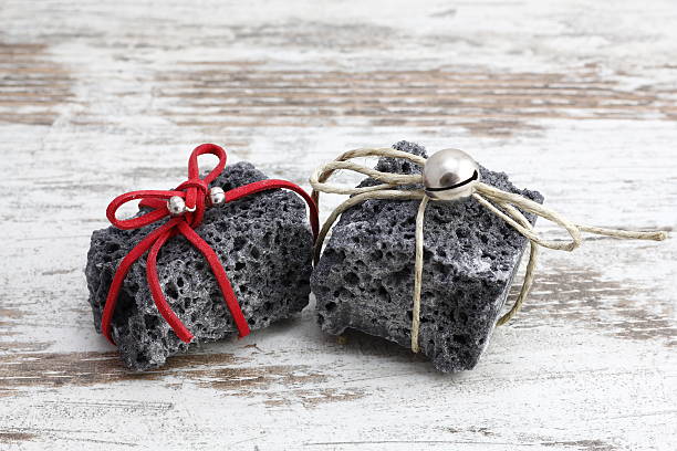 istock Christmas coal in a wood background 627248036