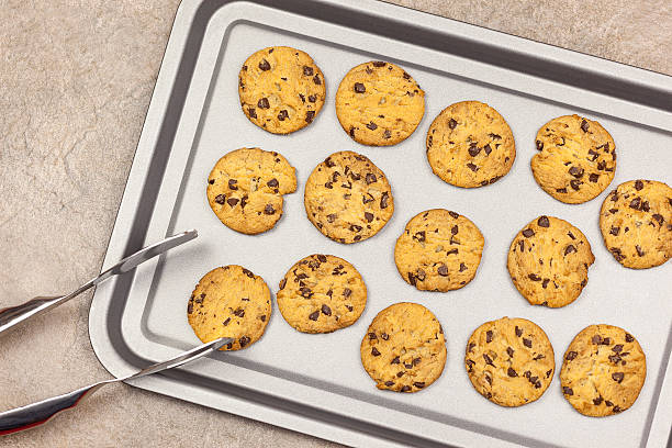 istock Fresh chocolate chip cookies on a baking tray 627248048