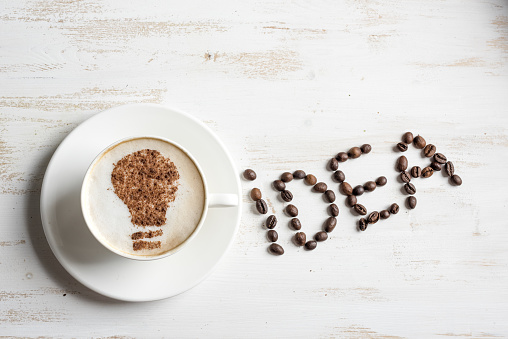 Coffee with lightbulb made of cinnamon. Brain storm or idea concept. Coffee-break.