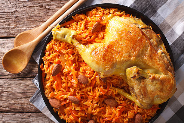 istock Arabic Food Kabsa: chicken with rice and vegetables close-up 627249044