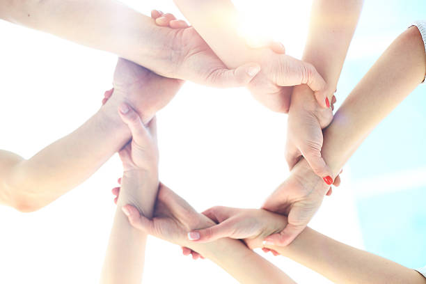 istock Ring of hands teamwork showing your product 627252542