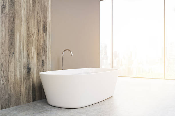 istock Side view of a white bathtub, toned 627252596