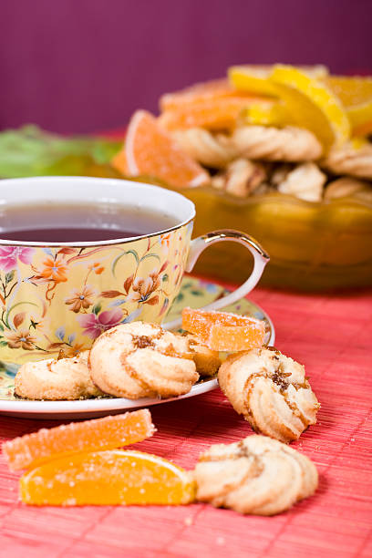 istock Cup of tea and cookies 627255110