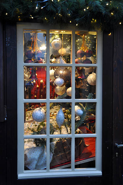 istock Christmas decorations framed in window on sale 627260338