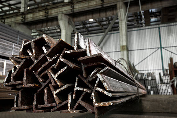 istock Stainless steell pipes, bars and beams deposited in stacks 627260614