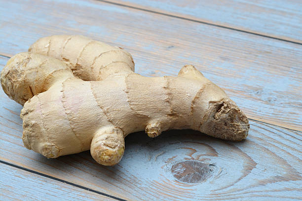 istock Ginger rood on wooden background with empty copy space 627260998