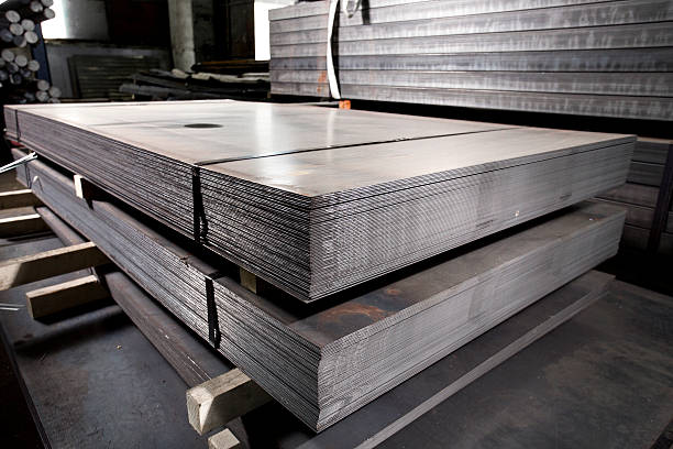 Stainless steel metal sheets deposited in stacks Stainless steel sheets deposited in stacks in a warehouse iron appliance photos stock pictures, royalty-free photos & images