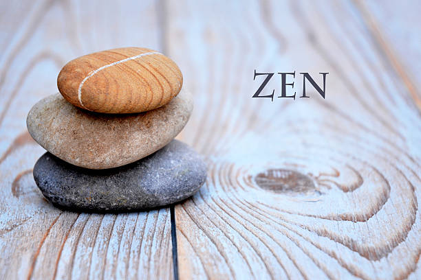 istock Three zen stones old wooden background with empty copy space 627262822