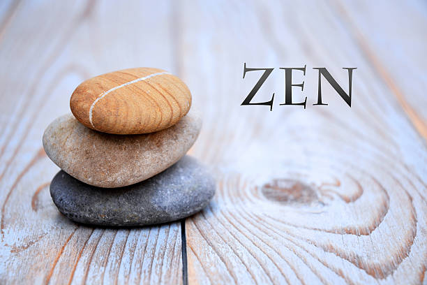 istock Three zen stones old wooden background with empty copy space 627262940