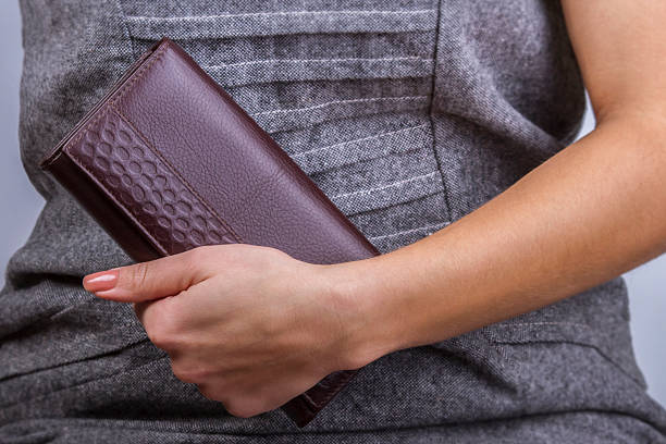 istock Woman with wallet in hand 627262942