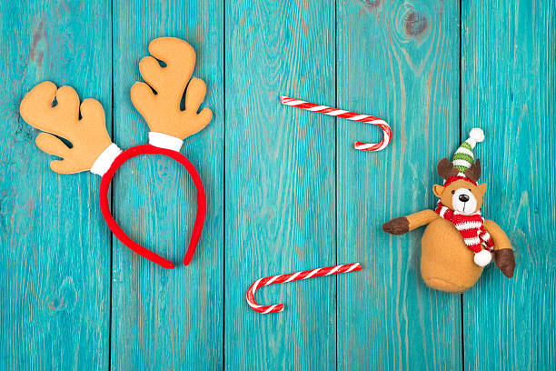 istock Toy reindeer antlers and teddy bear, candy 627263258