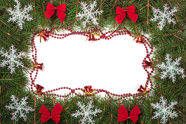 istock Christmas frame made of fir branches decorated with bows bells 627263276