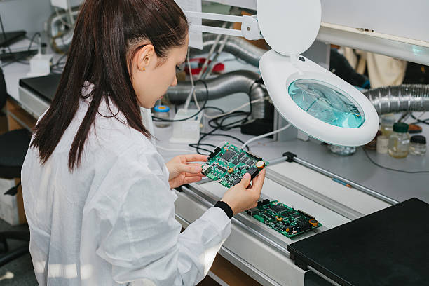 Microchip production factory. Technological process. Technician. Computer expert. Manufacturing. Engineering. stock photo