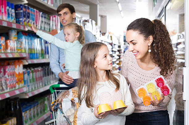 istock customers with children selecting sweet dairy products in hyper 627269758