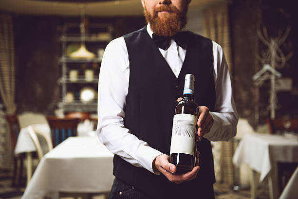 istock Man holding polished bottle with alcohol 627269768