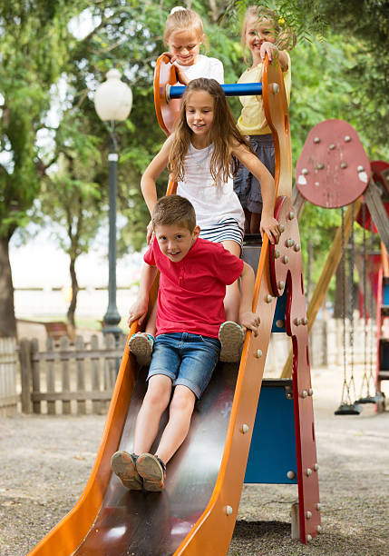istock Children playing on sliding toy 627270070
