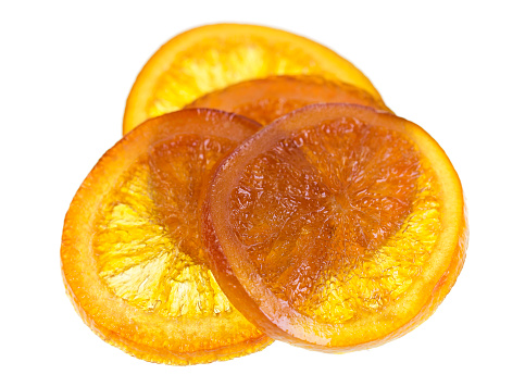 Sweet candied orange slice isolated on a white background
