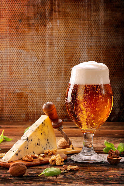 istock Blue cheese appetizer and beer on brown vintage background 627272720