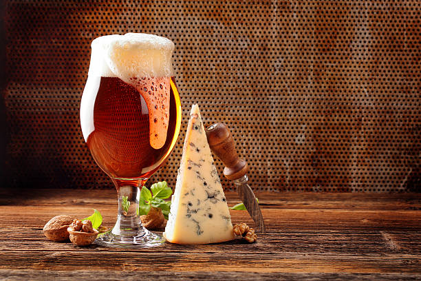 istock Blue cheese appetizer and beer on brown vintage background 627272750
