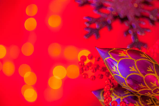 Red  christmas baubles on red background.