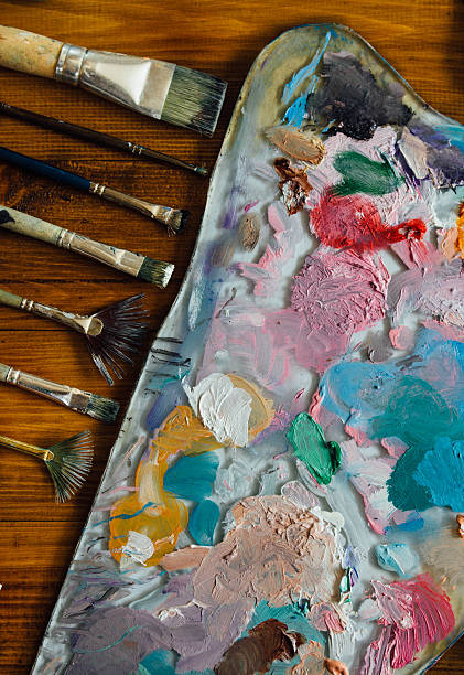 istock Palette of oil paints and brushes 627278724