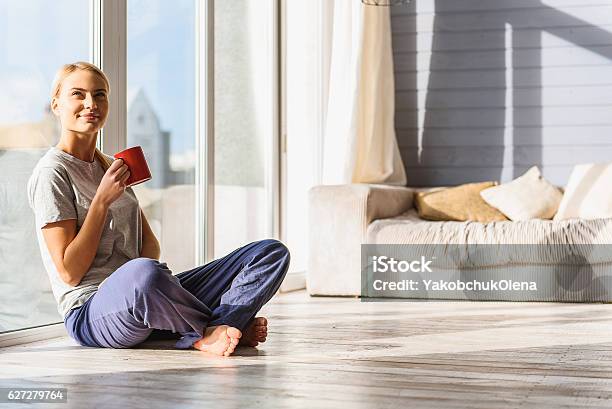 Happy Woman Enjoying Homey Morning Stock Photo - Download Image Now - Women, Window, Heat - Temperature