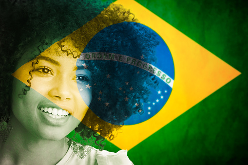 portrait of a black Brazilian woman with flag