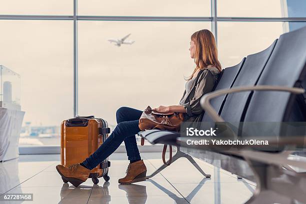 Smiling Girl Waiting For Boarding Stock Photo - Download Image Now - Airport, Travel, Women
