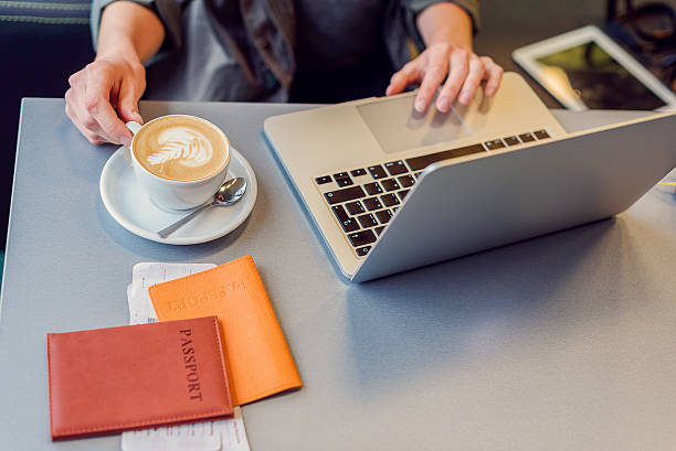 istock Beautiful girl using laptop in airport 627282372