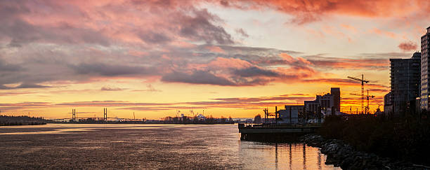 istock city at riverside with evening glow 627283340