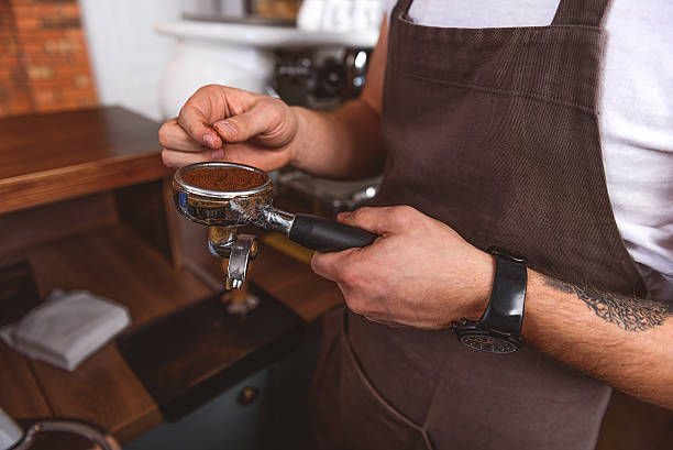 istock male coffeemaker standing with portafilter 627283884