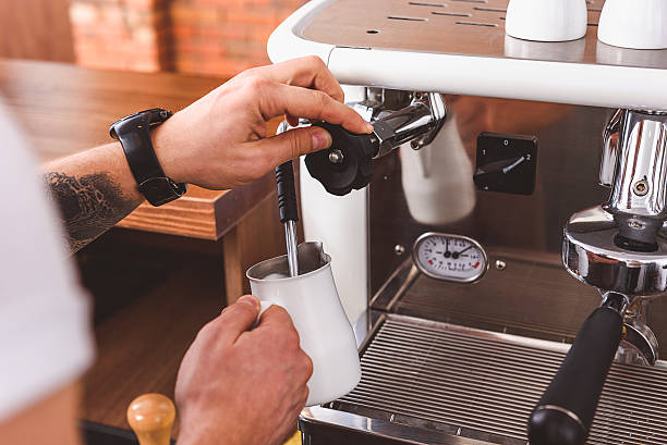 istock Skillful bartender poring coffee cream from machine 627284738