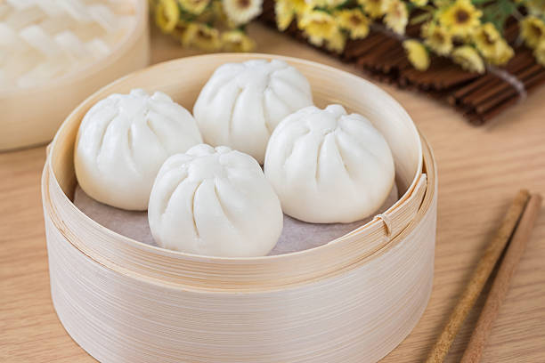 istock Steamed buns in bamboo steamer basket 627287138