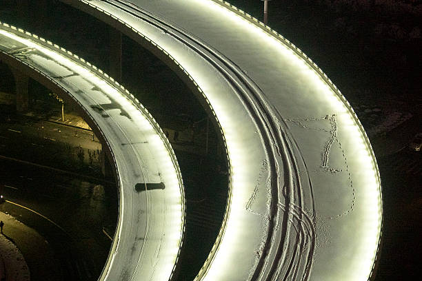istock light on snow covereing on driveway and overpass 627288350