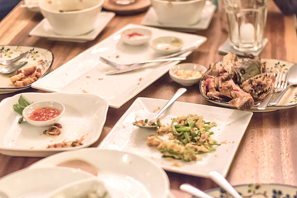 istock dirty plates after many people dinner 627291066