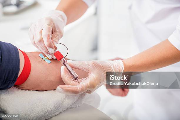 General Practitioner Doing Blood Test Stock Photo - Download Image Now - Blood Donation, Close-up, Senior Adult