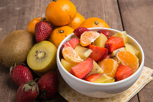 istock ftuits salad on the wood background. 627297560