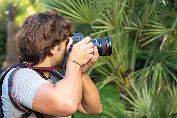 istock Photographer taking pictures  in forest 627304210