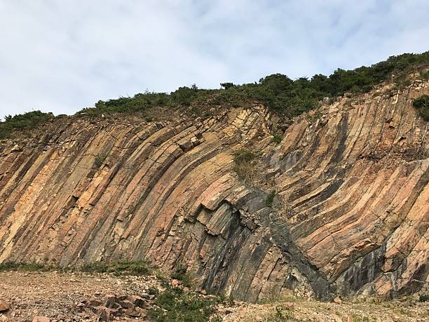 istock Twisted hexagonal rock columns in Hong Kong Geopark 627304308